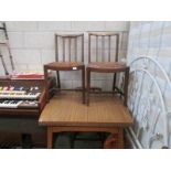 A formica top table and 4 chairs