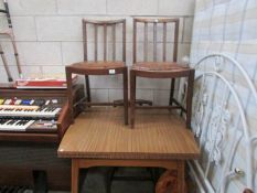 A formica top table and 4 chairs