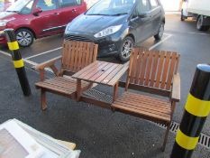 A 2 seat garden bench with centre table