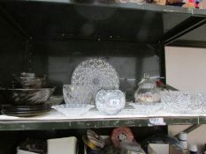 A shelf of glass ware