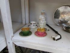 2 Demi Tasse cups and saucers, a 19th century nodding figure,