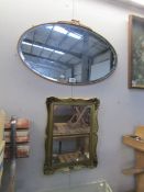 An oval mirror and one other