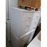 A pair of 3 drawer white chests