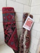 2 red ground patterned rugs