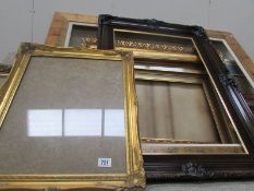 A quantity of large picture frames