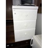 A white 3 drawer bedside chest