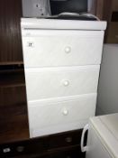 A white 3 drawer bedside chest