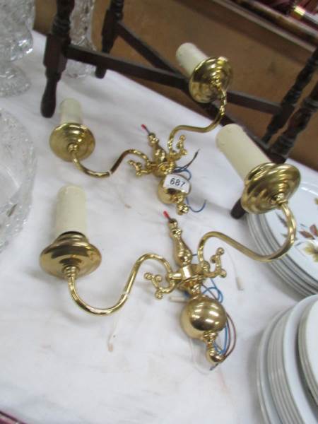 A pair of brass wall lights