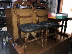 A pair of Victorian mahogany balloon back chairs in need of re-upholstering