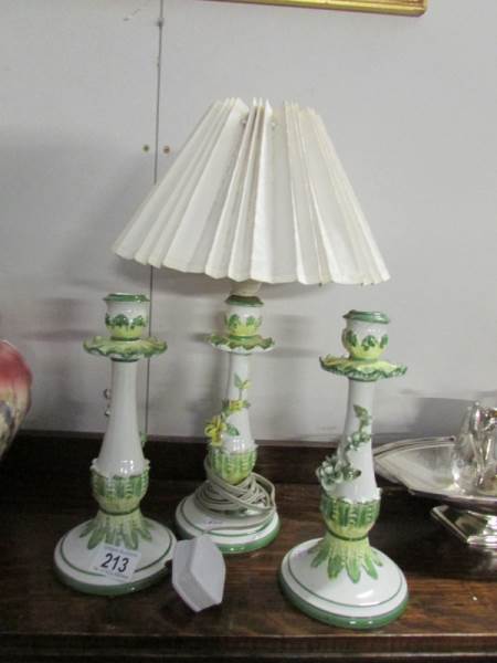 A table lamp and a pair of matching candlesticks