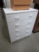 A white 5 drawer chest