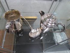 A silver plated teapot,