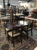 An oval dining table and 5 chairs