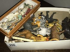 A box of toy animals etc