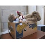 A box of dolls and soft toys