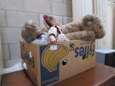 A box of dolls and soft toys