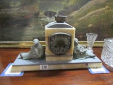 A French art deco marble mantel clock surmounted boy and girl