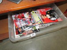 A collection of Manchester United Review football programmes