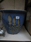 A large earthenware garden pot