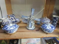 A shelf of blue and white included lidded bowls
