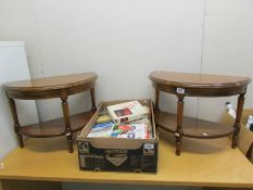 A pair of small D shaped tables