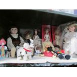 A shelf of dolls and other toys