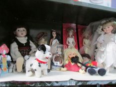 A shelf of dolls and other toys