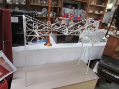 A wrought iron plant stand