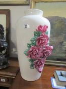 A floral encrusted vase