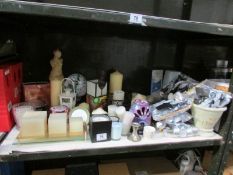 A shelf of assorted candles