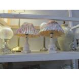 A shelf of table lamps
