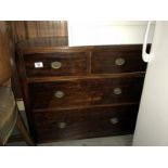 A 2 over 2 mahogany effect chest of drawers