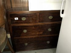 A 2 over 2 mahogany effect chest of drawers