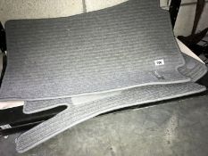 A pair of Mercedes Benz car mats