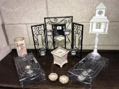 A quantity of candle holders and 2 new plate warmers