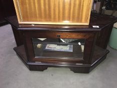 A mahogany effect TV/DVD stand