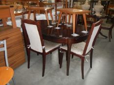 An extending dining table and 4 chairs