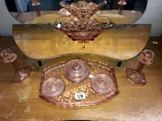 A pink glass dressing table set