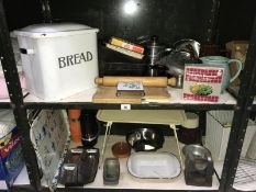 A large enamel bread bin and other kitchen items (2 shelves)