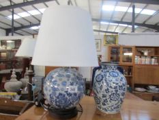 A blue and white table lamp together with a lidded jar