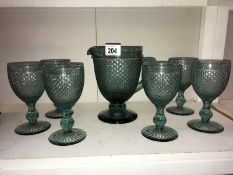 A blue/green glass drinking set