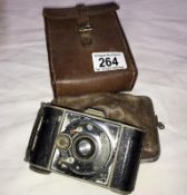 A vintage camera in leather case