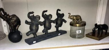 4 elephant ornaments including biscuit barrel