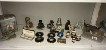 An assortment of collectable figures including Royal Worcester, Goebel, Wade, Beswick etc.