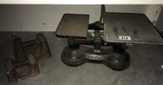 A set of cast iron scales & 2 large weights
