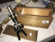 A Milbro microscope in wooden case