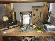 A shelf of miscellaneous including 9 spot bone dominoes & mirrored frame etc.