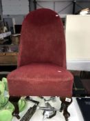 A 1930's nursing chair with Queen Anne legs