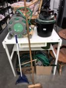 A hose reel, buckets,