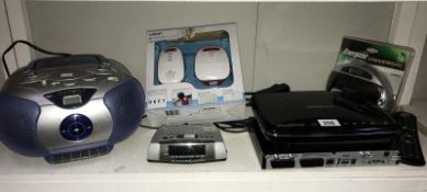 A quantity of electrical items including CD player, Freeview box & battery charger etc.